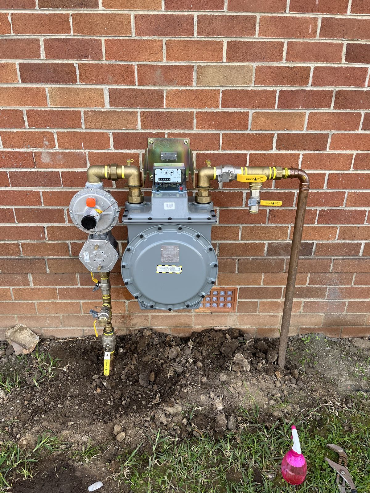Newly installed residential gas meter assembly with regulators and isolation valves, compliant to AS/NZS 5601