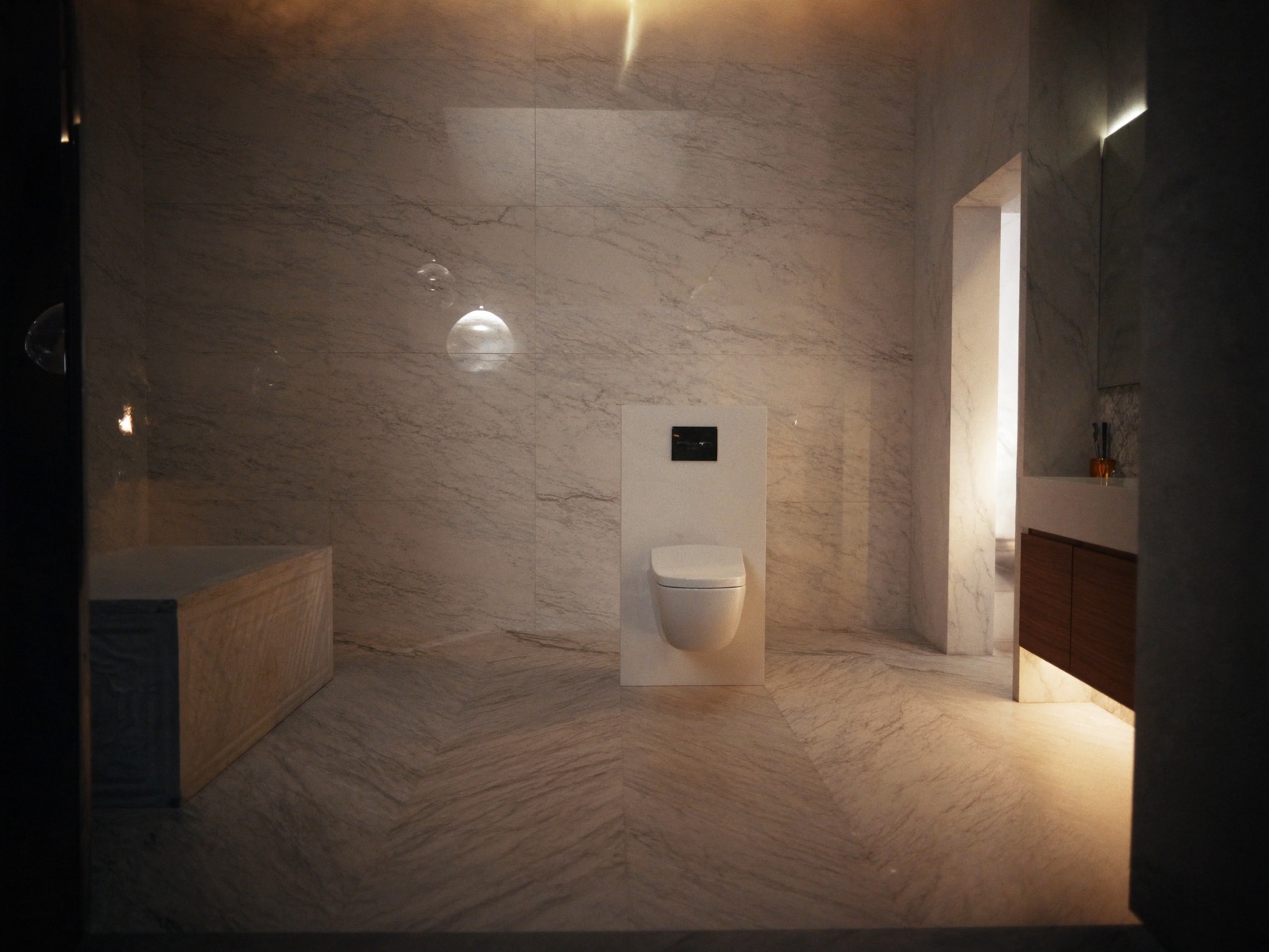 Marble ensuite with concealed cistern toilet and pendant lighting