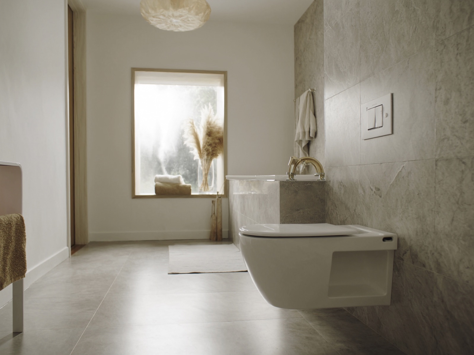 Modern bathroom with wall-hung toilet and marble feature wall