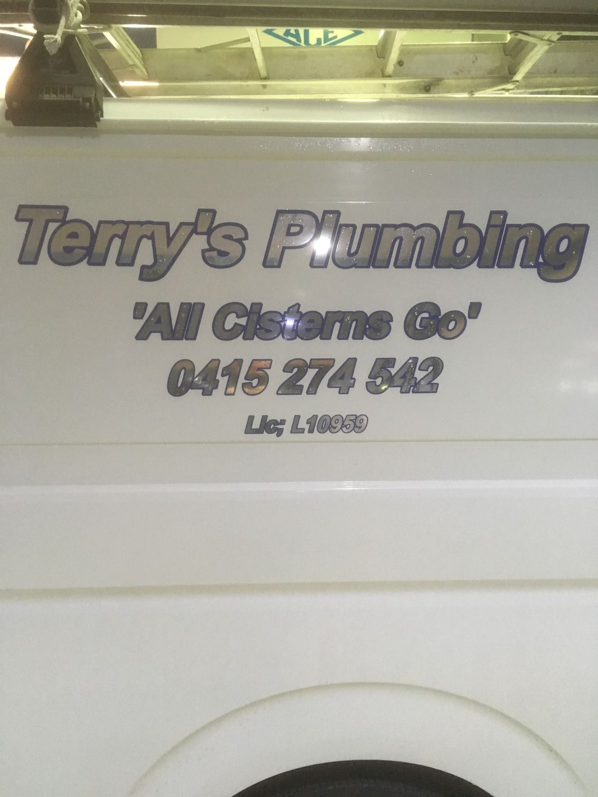 Terry's Plumbing van signage close-up - Lic L10959, 0415 274 542